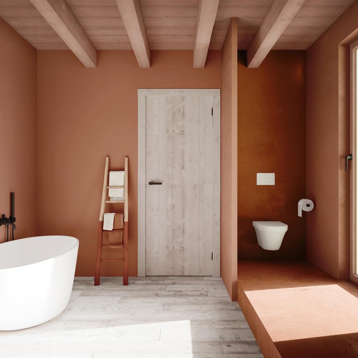 Creëer een intieme badkamer met warme verfkleuren